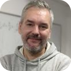 A portrait of Dmitry Vetrov, a team member.